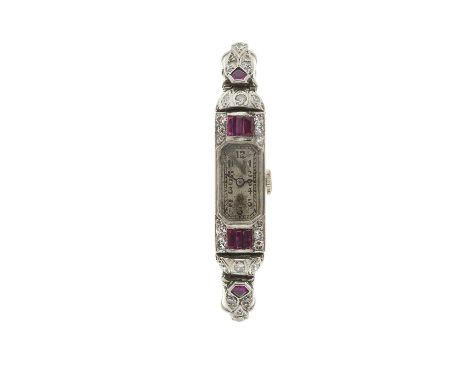 An Art Deco platinum, calibre-cut ruby and single-cut diamond cocktail watch, with similarly-cut diamond ruby accent lugs, un