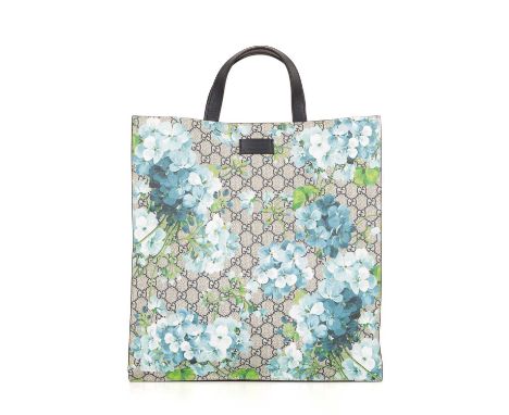 Gucci, a supreme Blooms vertical tote, crafted from the maker's GG coated canvas exterior, overlayed with a blue floral print
