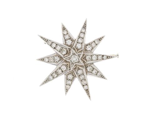 A large silver and gold, brilliant-cut diamond star brooch, estimated total diamond weight 2.80ct, predominantly K-L colour, 