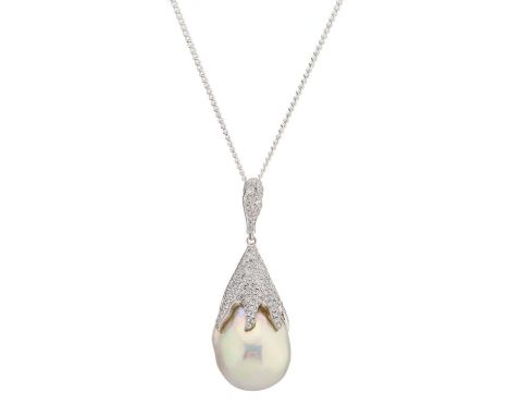 An 18ct gold baroque pearl pendant, with pave-set diamond cap and similarly-set surmount, suspended from a white metal chain,