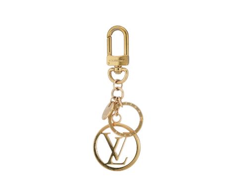 Louis Vuitton, a gold-tone key holder bag charm, featuring the maker's LV logo, with keyring and lobster clip fastening, leng