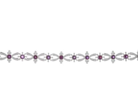 A platinum ruby and brilliant-cut diamond openwork geometric bracelet, with partially concealed push-piece clasp, total ruby 
