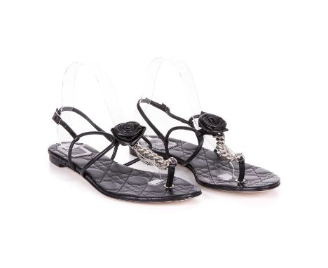 Christian Dior, a pair of unworn black leather thong sandals, featuring a leather central rosette, silver-tone T-strap chain 