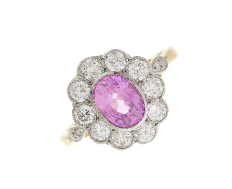 An 18ct gold and platinum pink sapphire and brilliant-cut diamond cluster ring, with similarly-cut diamond accent fleur-de-ly