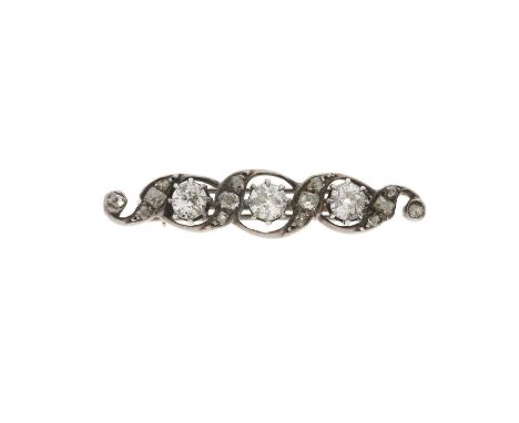 A mid 19th century silver and gold, old-cut diamond brooch, of scrolling design, estimated total diamond weight 1.10ct, princ