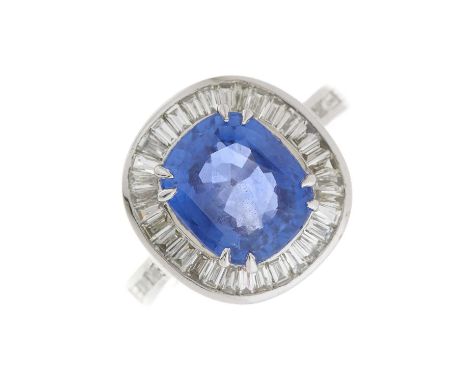 A cushion-shape sapphire and calibre-cut diamond cluster ring, with similarly-cut diamond gallery and shoulders, sapphire est