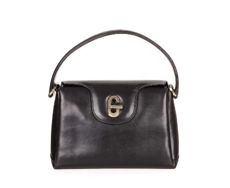 Gucci, a vintage G Turn-Lock handbag, crafted from smooth black leather, with gold-tone hardware, single flat leather handle,