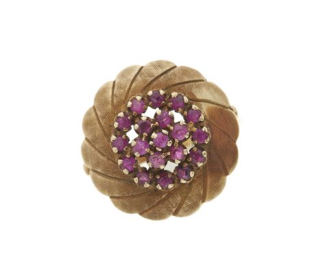 A 1970s 14ct gold ruby floral cluster dress ring, with engine turned swirl surround, import marks for London 1977, ring size 