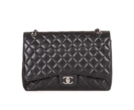 Chanel, a Maxi Classic Double Flap handbag, featuring the maker's signature black quilted caviar leather exterior, with silve