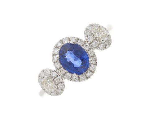 An 18ct gold sapphire and brilliant-cut diamond cluster ring, with vari-cut diamond cluster sides, sapphire weight 1.12ct, to