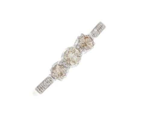 A mid 20th century 18ct gold and platinum, circular-cut diamond three-stone ring, with single-cut diamond accent shoulders, e