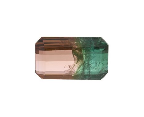 A natural parti-coloured tourmaline, weighing 14.70ct, measuring approximately 18 by 11.2 by 7.2mm, currently loose from moun