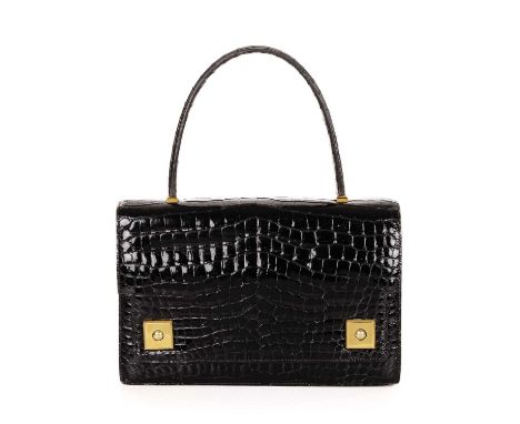 Hermes, a 1960's crocodile Piano handbag, featuring gold-plated hardware accents, with a single looping top handle, flap clos