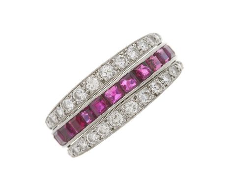 An Art Deco platinum calibre-cut ruby and sapphire full eternity flip ring, with circular-cut diamond hinged sides, estimated