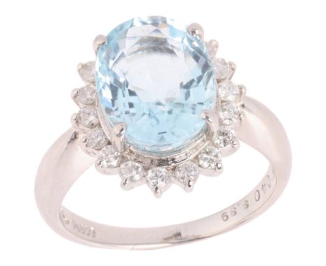 An Aquamarine and Diamond Cluster Ring,the oval cluster set with an oval mixed cut aquamarine weighing approximately 3.39 car