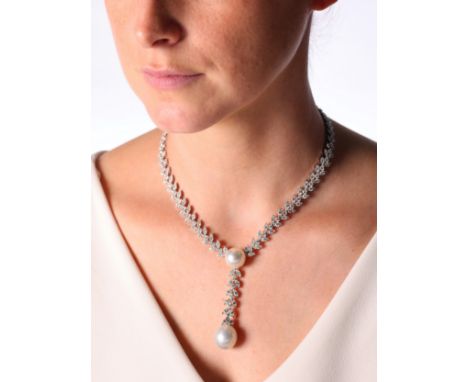 A South Sea Pearl and Diamond Necklace,the central drop set with round cultured pearl measuring approximately 15.3mm suspendi
