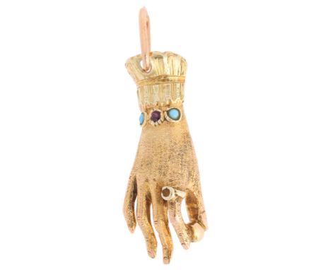 A Turquoise and Ruby Hand Pendant,in the form of a hand holding a ball with a ring on the index finger, the wrist set with tu