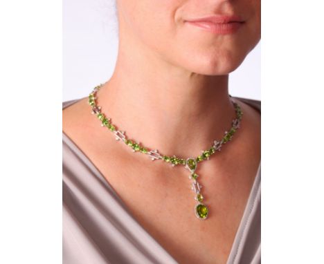 A Peridot and Diamond Necklace,the central drop designed as a top pear halo cluster set with pear cut peridot and modern roun