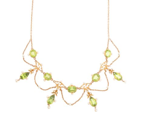 An Antique Edwardian Peridot and Pearl Festoon Necklace,circa 1905, set with pear cut peridot floral drops mounted by whole a