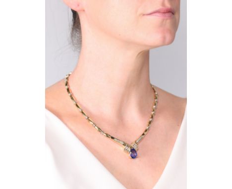 A Tanzanite and Diamond Collar Necklace,set with a pear cut Tanzanite weighing approximately 5.00 carats, the collar channel 