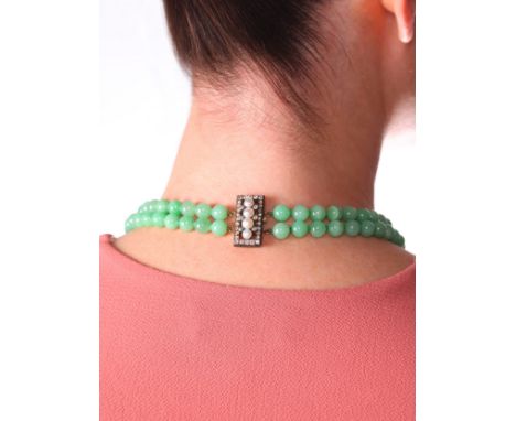 A Jadeite Jade, Pearl and Diamond Necklace,comprising two rows of even sized knotted jade beads measuring 8.3-8.5mm, the Anti