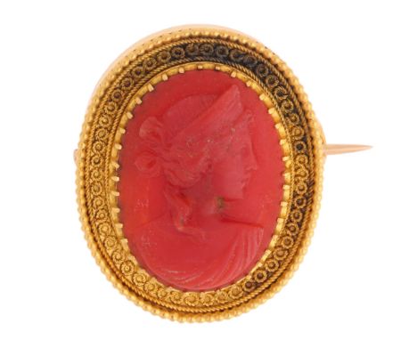 An Antique Victorian Coral Cameo Brooch,circa 1880, set with an oval relief carved coral plaque depicting Greek Goddess, Hera