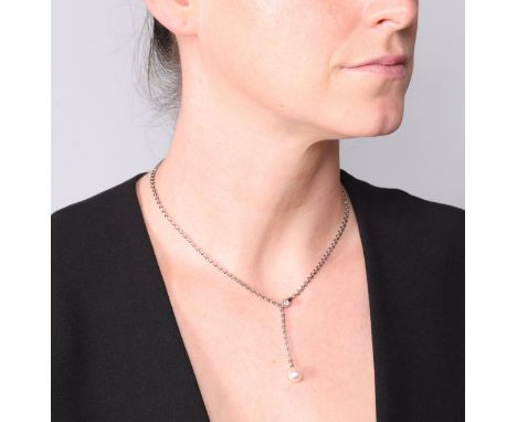 CARTIER - An Akoya Pearl and Diamond Lariat Necklace,circa 2001, the drop set with an 8.8mm cultured white Akoya pearl, suspe