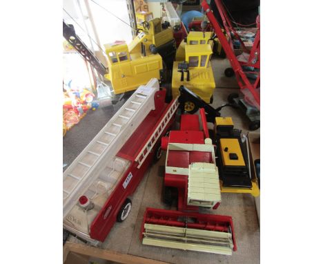 Three Tonka pressed tin toys to include Mighty Crane, T-6 Bulldozer and Fire Engine together with an ERTL International Hydro