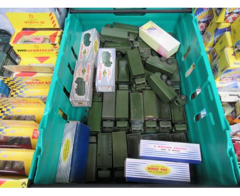 A large collection of loose and playworn Dinky Toys military 622 10-Ton Army Trucks, some repainted, together with two boxed 