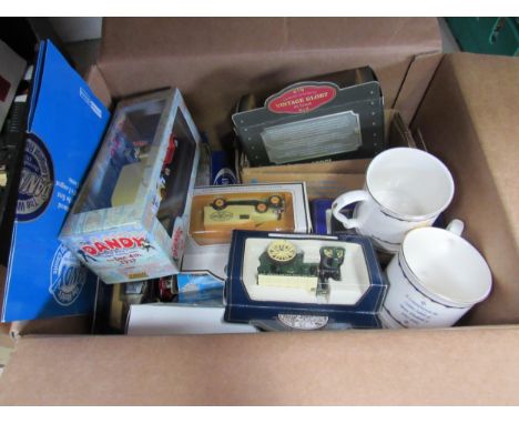 A collection of boxed and loose diecast vehicles including Lledo Golden Jubilee buses with accompanying cups, Dandy commemora