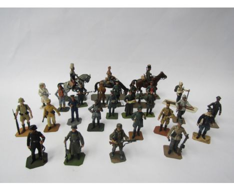 A collection of lead figures of German soldiers from various regiments including Luftwaffe, Army, Kriegsmarine, mounted offic