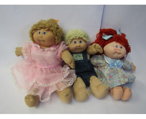 Three Cabbage Patch Kids dolls