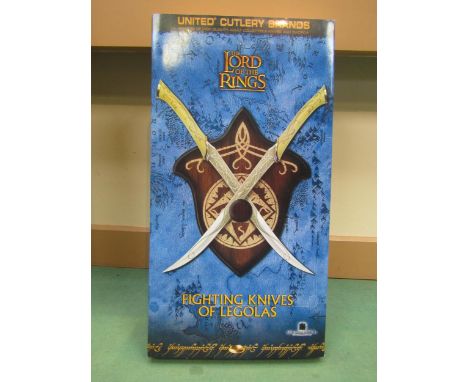 A boxed set of United Cutelry Lord Of The Rings Fighting Knives Of Legolas 1/1 scale licensed reproduction of the knives used