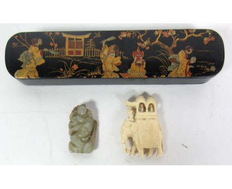 A 19th Century lacquered papier mache Chinese Pen Box, decorated and highlighted in the Oriental taste; a carved ivory Figure