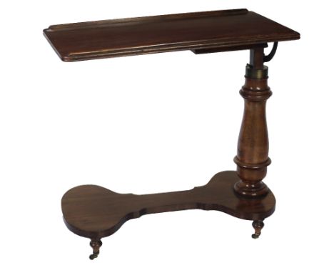 An Irish Victorian mahogany Bed Tray on stand, possibly Strahan, with turned pillar support terminating on a guitar shaped ba