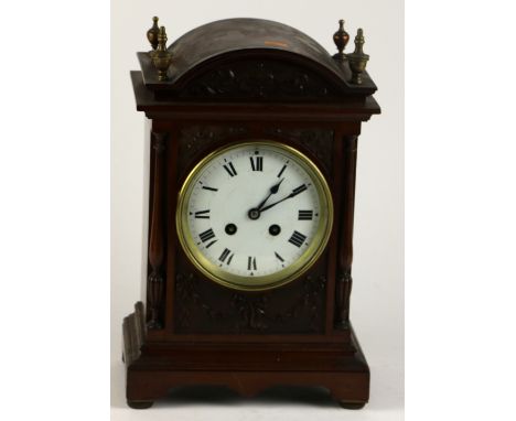 A small attractive carved Edwardian walnut Mantle Clock decorated in the Adams style, with a circular enamel dial with Roman 