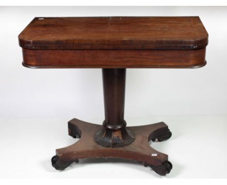 A William IV period mahogany fold-over Card Table, with crossbanded top over a plain frieze supported by a circular pillar te