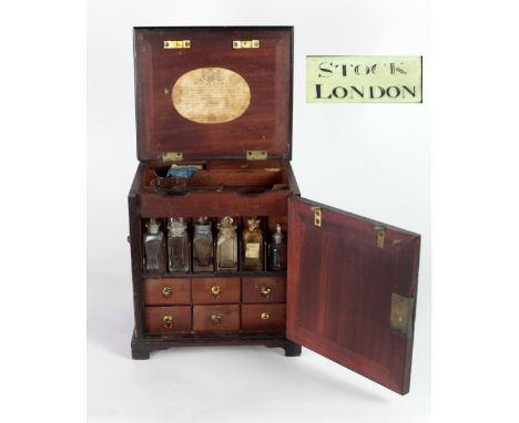 An important 19th Century mahogany Apothecary Domestic Chest, by Stock of London, with lift top and opening door, with fitted