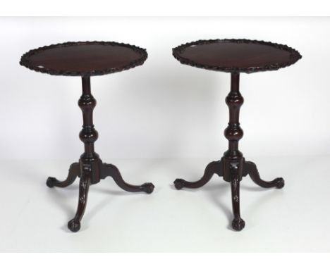 A pair of Georgian style mahogany Wine Tables, with decorative rims on carved tripod bases with ball n' claw feet. (2)