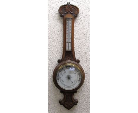 A 19th Century carved oak Aneroid Barometer. (1)