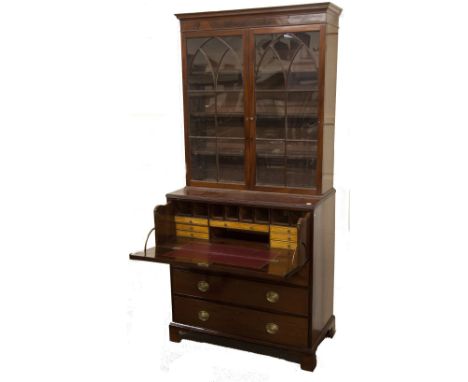 An attractive Georgian period mahogany Bureau Bookcase, with plain pediment over two glazed Gothic doors on a base with drop 