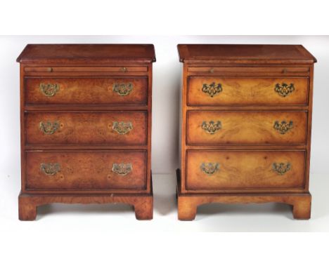A pair of Georgian style three drawer Miniature Chests, with crossbanded tops and brush n' slide, on bracket feet, approx. 63