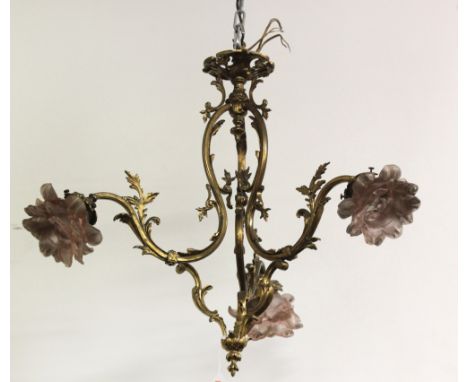 A 19th Century French ormolu three branch Ceiling Light, with S scroll arms and coloured moulded glass shades in the form of 