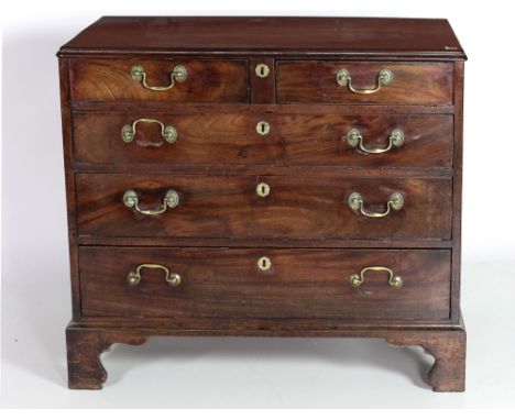 A Georgian mahogany Chest, with later moulded top over two short and three long drawers, with drop brass handles on bracket f