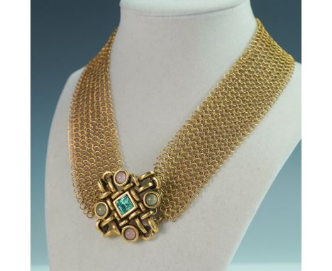 An exquisite statement necklace featuring an intricate gold-toned chain mail design, creating a bold yet elegant draped effec
