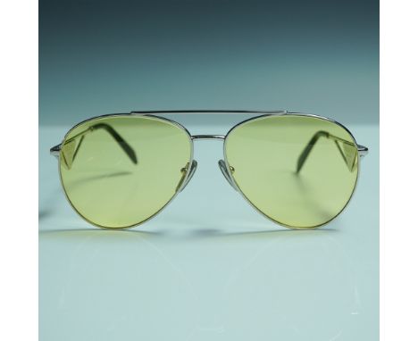 A pair of Prada designer aviator style sunglasses, model SPR 73Z, featuring lightweight silver tone metal frames paired with 