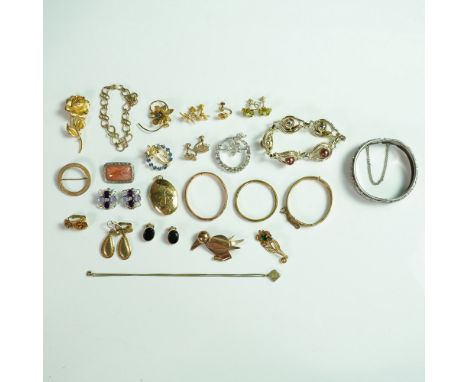 A captivating 24-piece collection of vintage costume jewelry featuring an array of brooches, earrings, necklaces, and bracele