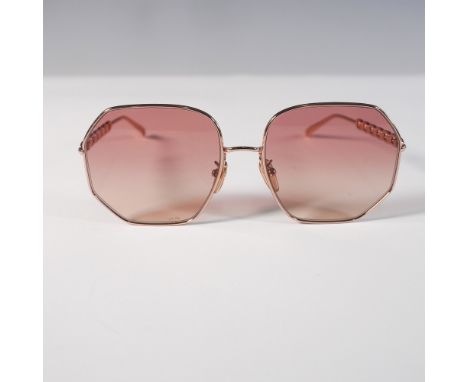 Luxurious Louis Vuitton sunglasses featuring an oversized geometric frame with rose gold-tone metal construction. The temples