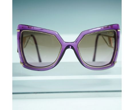 Striking pair of Cazal designer sunglasses, Model 8506, in color 004. Featuring a bold purple acetate frame with geometric ov