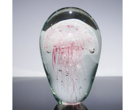Mesmerizing hand-crafted art glass paperweight featuring a stunning pink jellyfish suspended within a crystal-clear dome. Thi